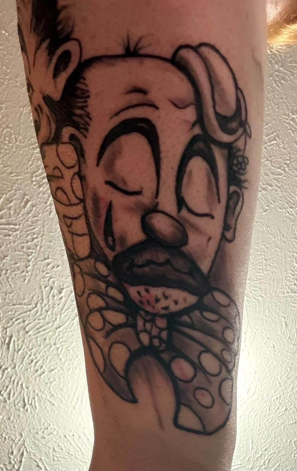 Polka-dot cartoon character tattoo