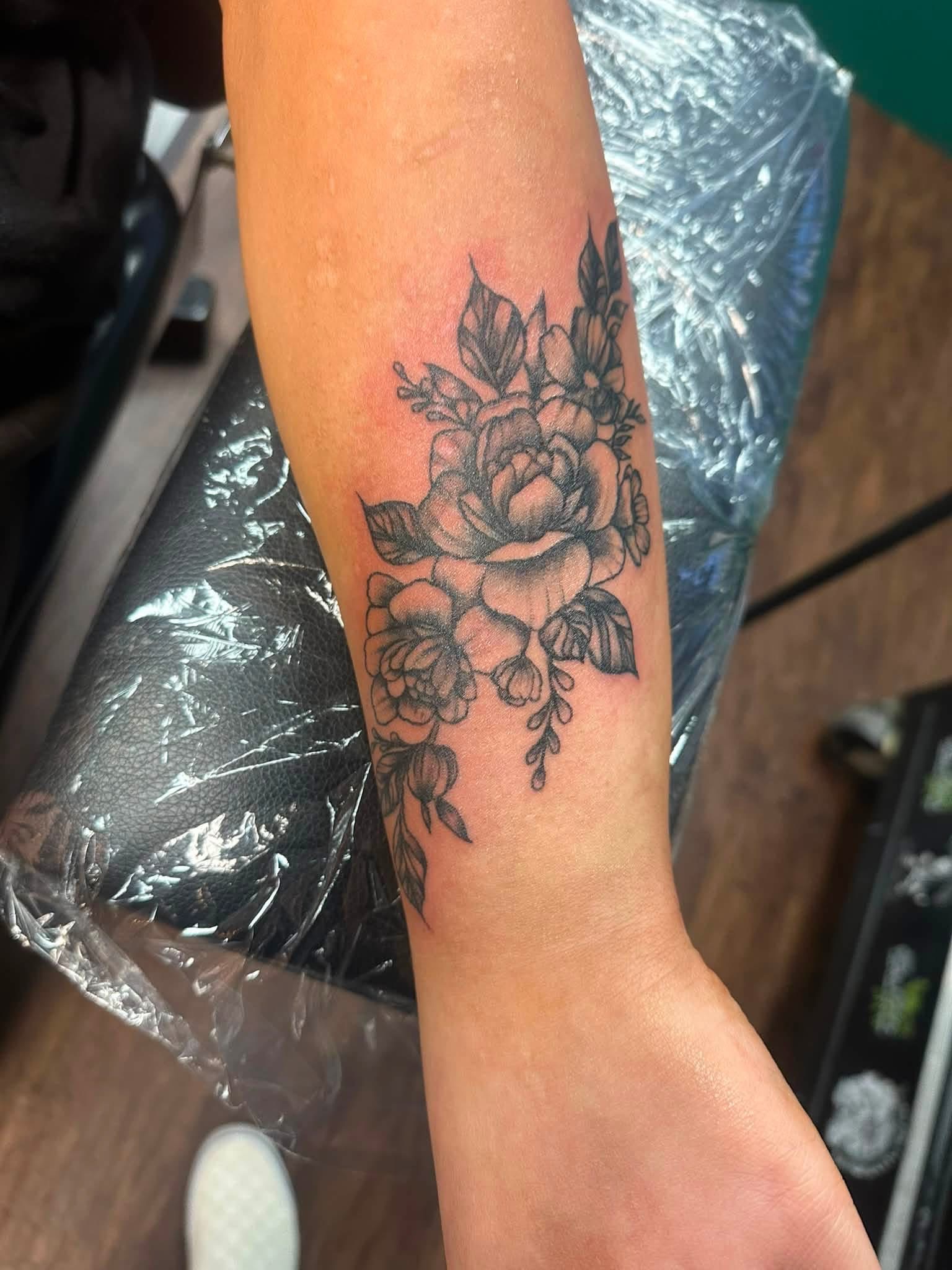 Floral arm tattoo