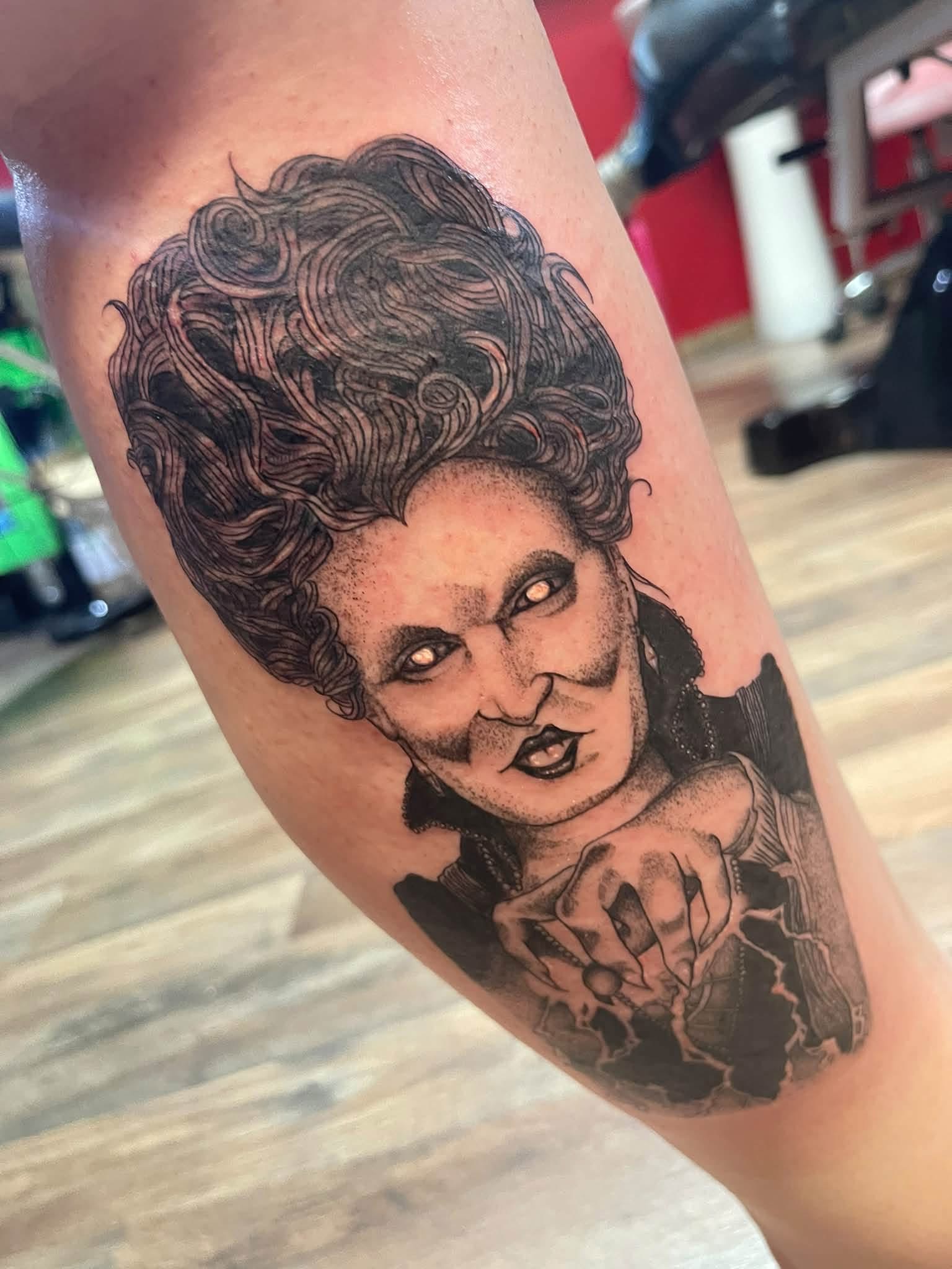 Character portrait tattoo with glowing eyes